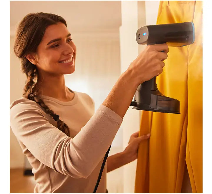 Compact and lightweight Braun QuickStyle 5 garment steamer, ideal for travel and quick touch-ups.