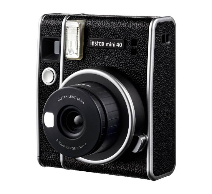 Close-up of the Fujifilm instax mini 40 with the lens pulled out for selfie mode and built-in mirror.