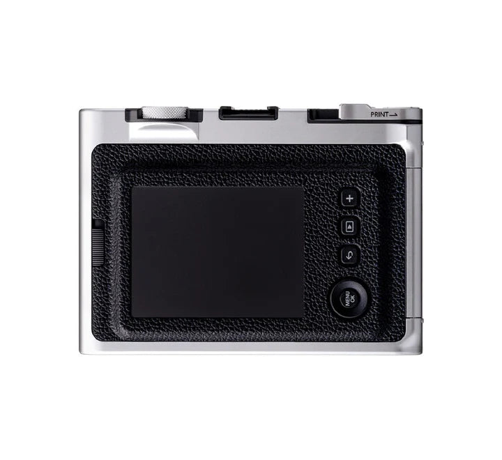 Close-up of the instax mini Evo lens and film dials used to create 100 different creative photo effects.