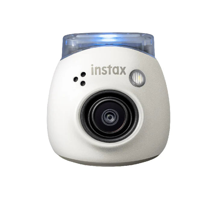 The instax Pal camera paired with an instax mini Link 2 smartphone printer and physical polaroid-style prints.