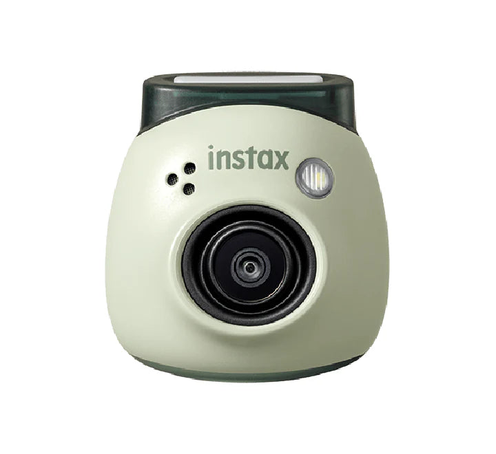 A person using the instax Pal camera with a smartphone app for remote shooting.