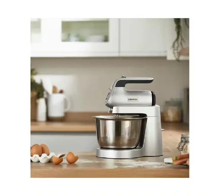 Flat lay showing the included stainless steel twin beaters, durable dough hooks, and clear splash guard for the Kenwood HMP54.000SI Combi mixer.