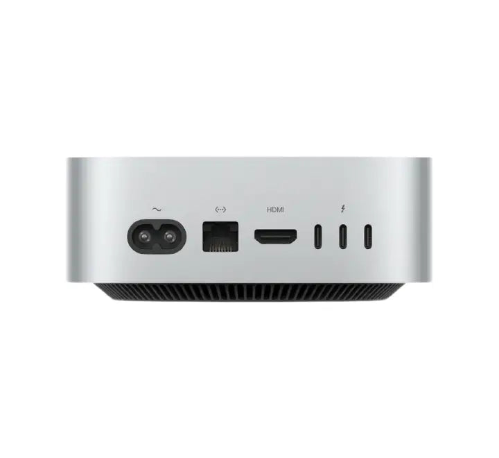 Ultra-compact Apple M6 Mac Mini set up on a modern wooden desk powering a high-resolution multi-monitor display workspace.