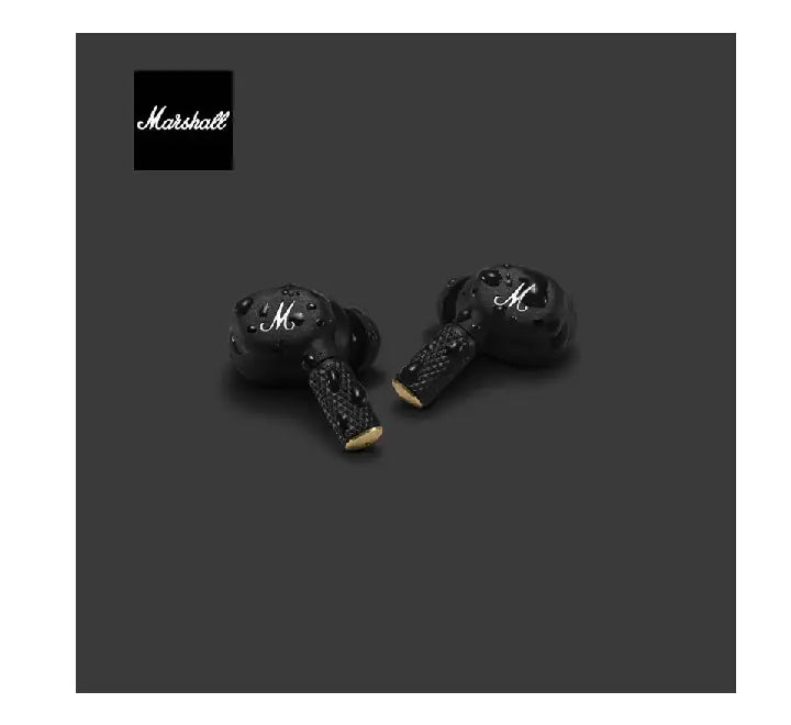 Close-up view of a user wearing the Marshall Motif II ANC earbud showcasing the classic gold script logo and ribbed stem design.