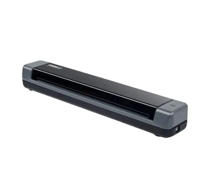 A sleek black Plustek MobileOffice S410 Plus scanner on an office desk, scanning a document while powered via USB cable connected to a laptop.