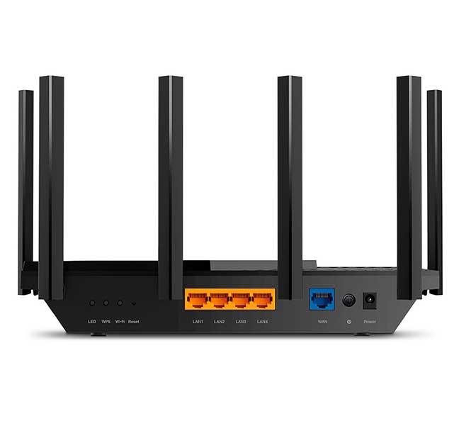 Rear panel view of the TP-Link Archer AX72 router showcasing the yellow gigabit WAN port, four blue gigabit LAN ports, power buttons, and a side USB 3.0 interface.