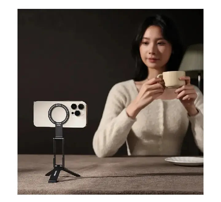 Ulanzi MA60 magnetic tripod deployed on a desk holding an iPhone in landscape mode