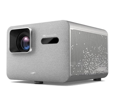 BenQ TK705i projector displaying sharp 4K content in a bright living room setup