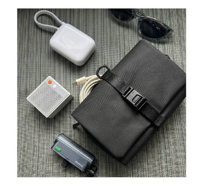 Mark Ryden MR59T hanging toiletry bag suspended by its hidden hook, showing the MagiClip magnetic closure system in use.