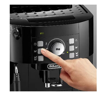The traditional cappuccino manual steam wand on the De'Longhi Magnifica S ECAM 12.122.B frothing milk in a pitcher.