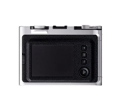 Close-up of the instax mini Evo lens and film dials used to create 100 different creative photo effects.