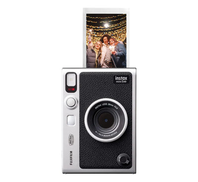 A person pulling the tactile print lever on the instax mini Evo to print an instant photo.