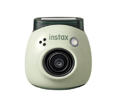 A person using the instax Pal camera with a smartphone app for remote shooting.