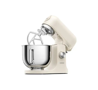 Kenwood kMix cream kitchen machine opened showing planetary baking tools attachment head.