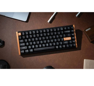 Close-up of the Hall Effect magnetic switches and keycaps on the Keychron K2HE black wood edition.