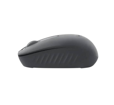 Logitech M196 compact Bluetooth mouse positioned neatly next to a slim ultrabook in a modern remote work setting.