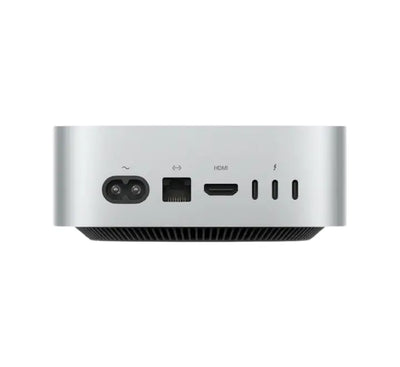 Ultra-compact Apple M6 Mac Mini set up on a modern wooden desk powering a high-resolution multi-monitor display workspace.