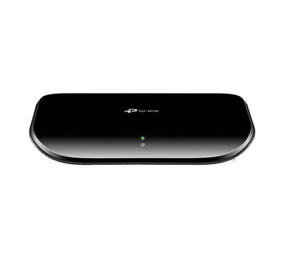 Front perspective of the TP-Link TL-SG1005D unmanaged 5-port gigabit desktop switch showing its clean plastic frame and LED indicators.