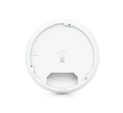An installed white Ubiquiti UniFi U7 Pro enterprise access point flush-mounted cleanly onto a modern office drop ceiling.