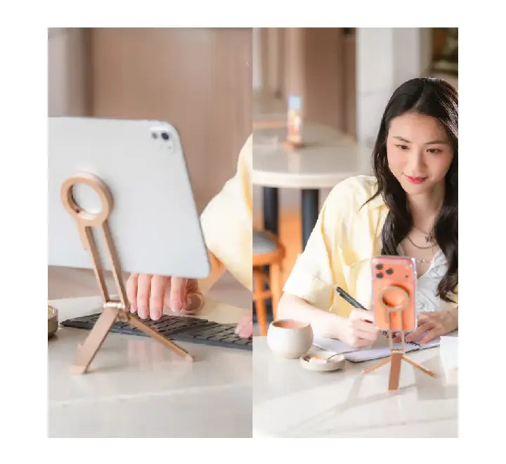 Using the UNIQ Arcus magnetic tripod in handheld selfie stick mode for content creation.
