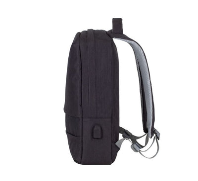 Hidden main zipper tracks on the back panel of a Rivacase 7562 black backpack showing anti-theft commuter safety features.